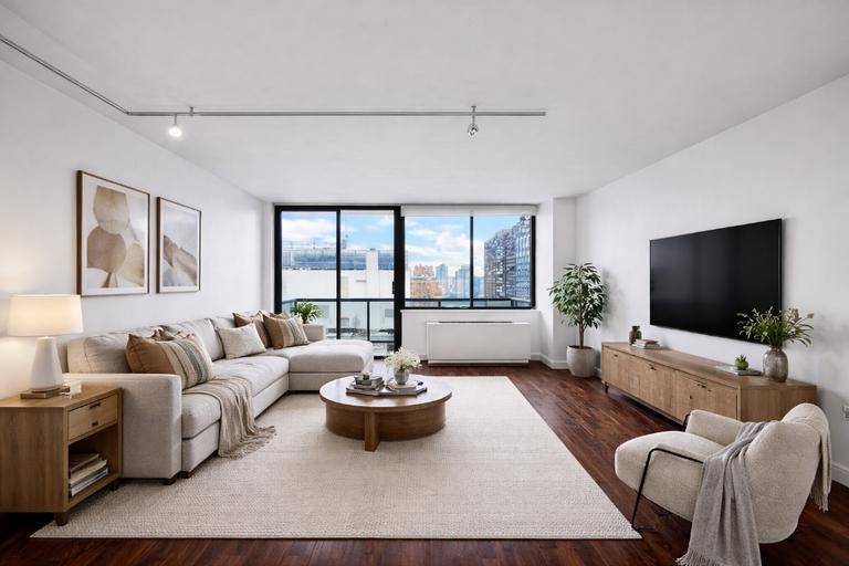 Bright high floor apartment with open city views in a full service Midtown East condominium.