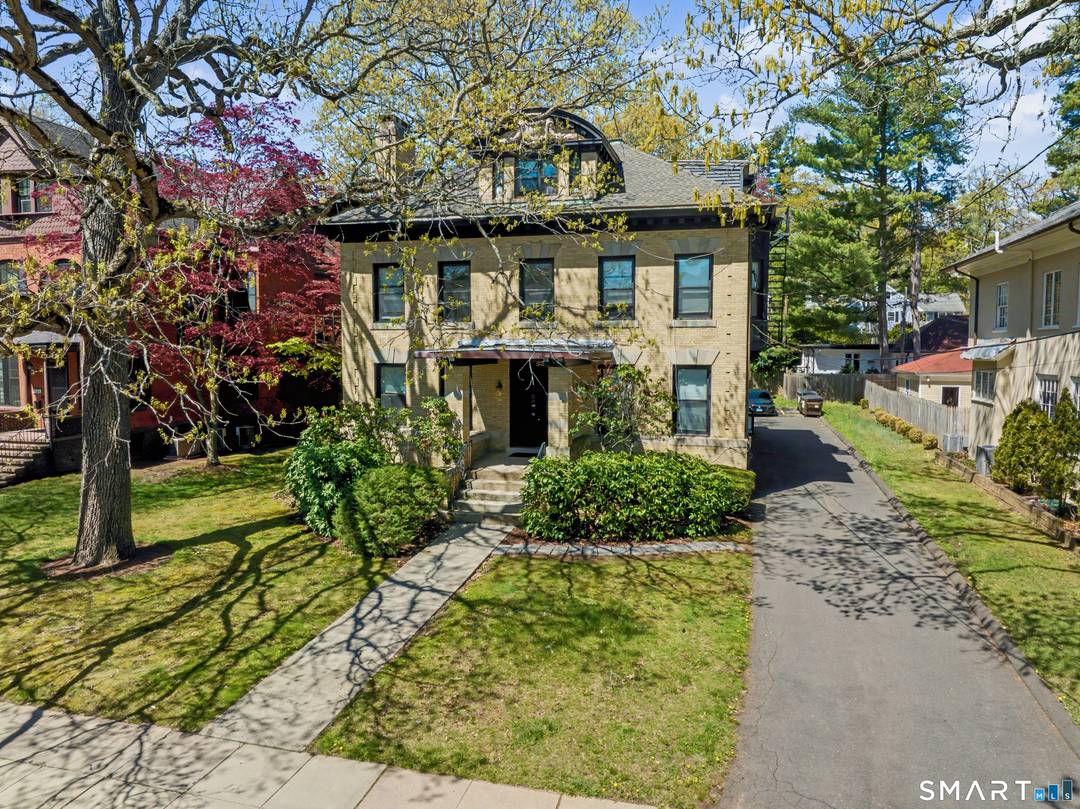 Stately and prominent 4, 379 sq ft brick building in the heart of East Rock on Whitney Ave.