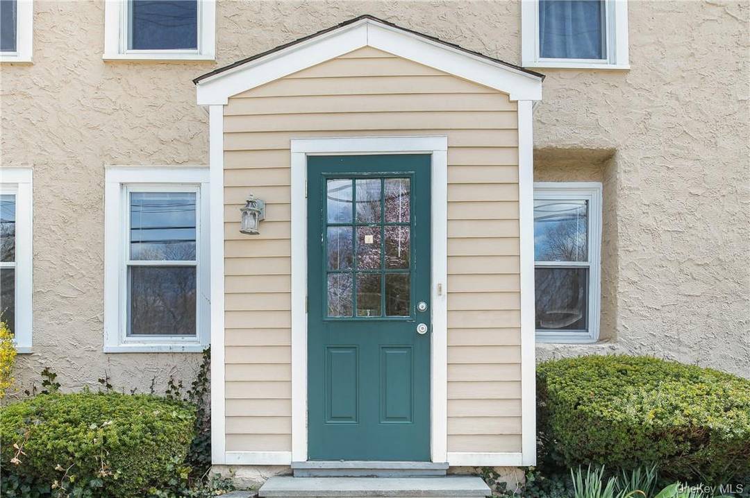 Beautiful updated 1st floor apartment with private front and back entrance and private fenced yard and driveway for 2 cars.