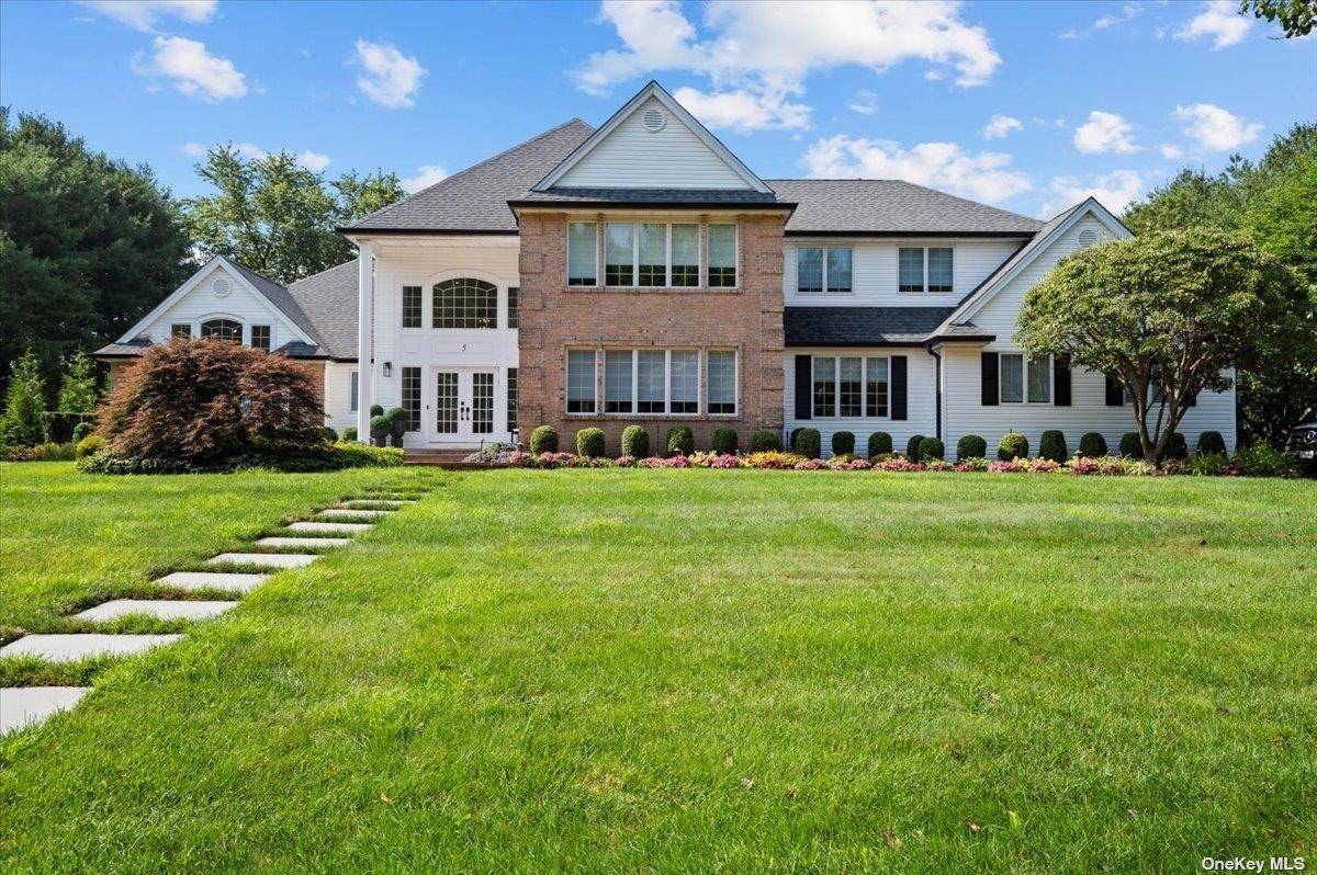 Welcome to an unparalleled realm of elegance at 5 Landing Court in Vanderbilt Manors West.
