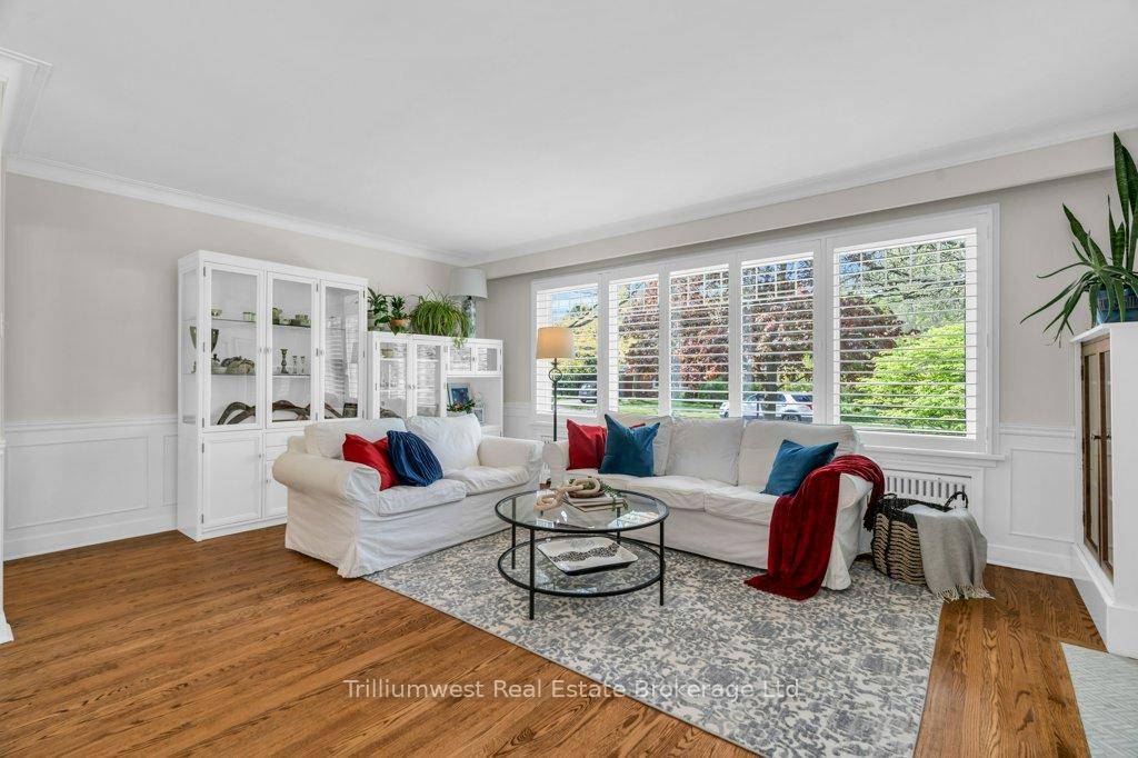 Welcome to 52 Forest Hill Drive, a timeless brick bungalow nestled on a mature lot in Guelphs prestigious Old University neighbourhood.