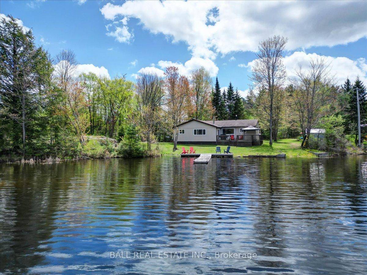 Charming 4 Season Bungalow on Weslemkoon Lake Escape to tranquility with this inviting 4 bedroom, 1 bath, four season bungalow set on a level, private lot just under an acre.