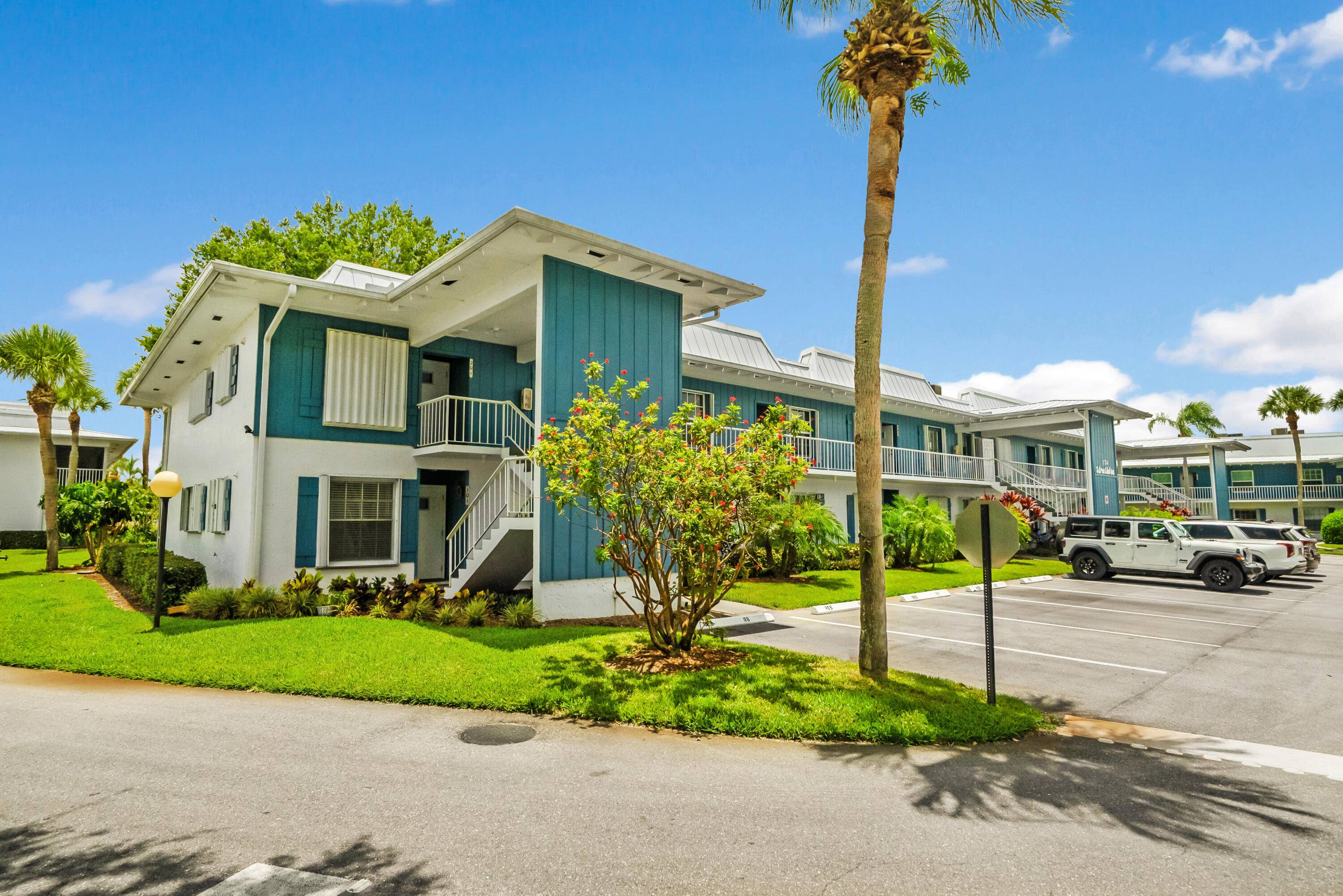Rare find ! Sought after first floor end unit in the Windjammer 55 waterfront boating condo association.