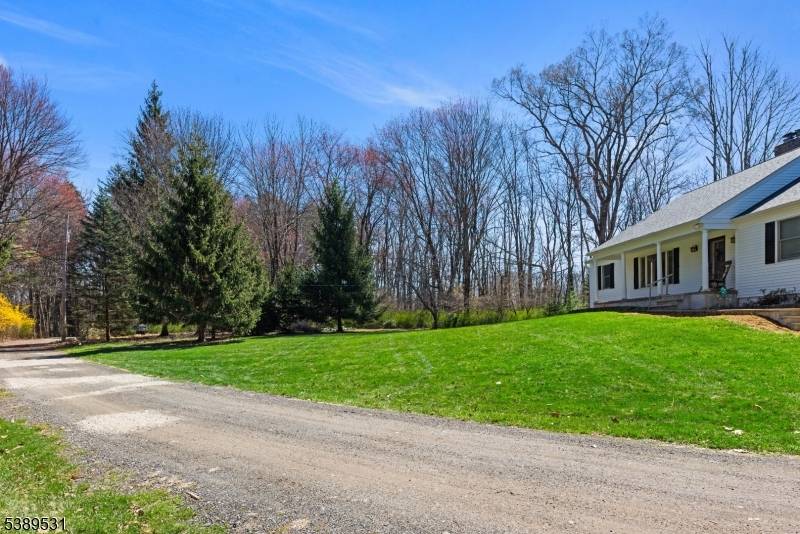 Charming Country Ranch on level, open and private 3 acre park like property in a fantastic neighborhood location.