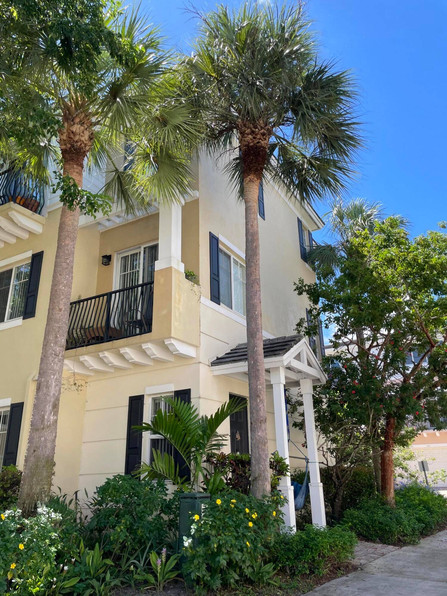 Light filled luxury turnkey townhome with windows on three sides, three Balconies, private Elevator, Infrared Sauna, EV Charger for all makes of EVs and Home Gym with free weights.