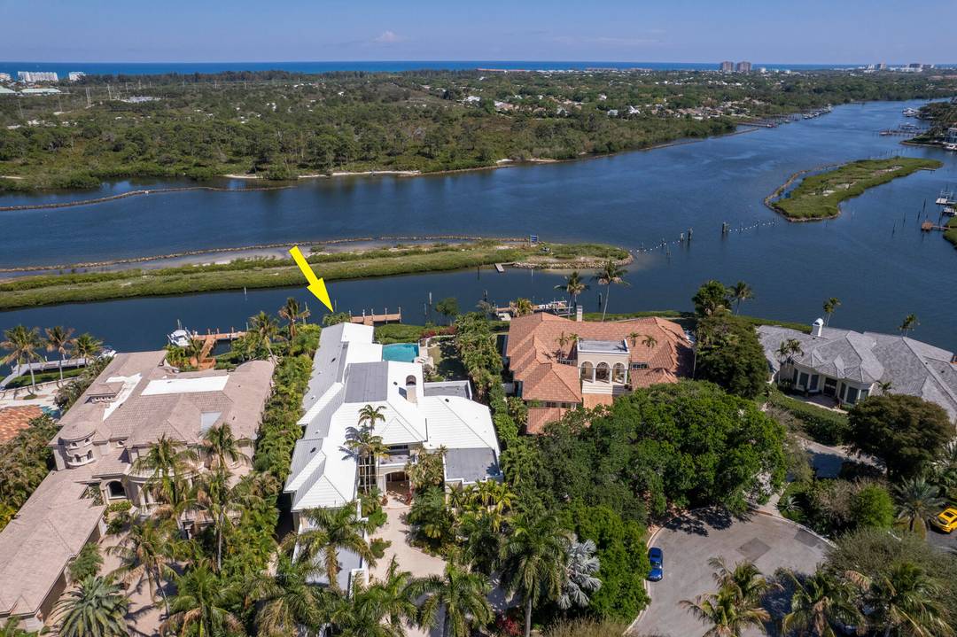 Rare opportunity to live on the most sought after street of Spyglass Court in Admirals Cove, Offering breathtaking views across a protected barrier island with no homes across, creating unmatched ...