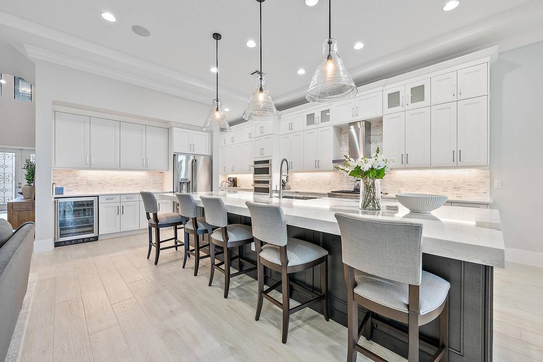 Built in 2023, this exceptional Vasari model is ideally situated on a rare long lakefront homesite, offering some of the most desirable and expansive water views in the community.