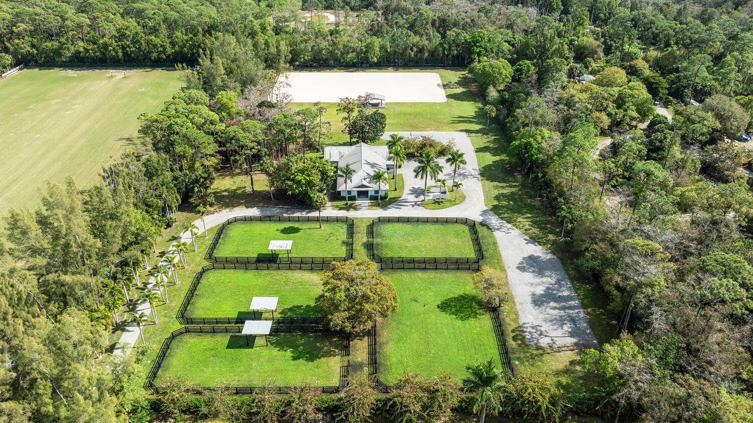 This exceptional turn key 5 acre equestrian property is located via a private, gated and landscaped drive on D Rd just north of Collecting Canal offering easy access to WEF ...