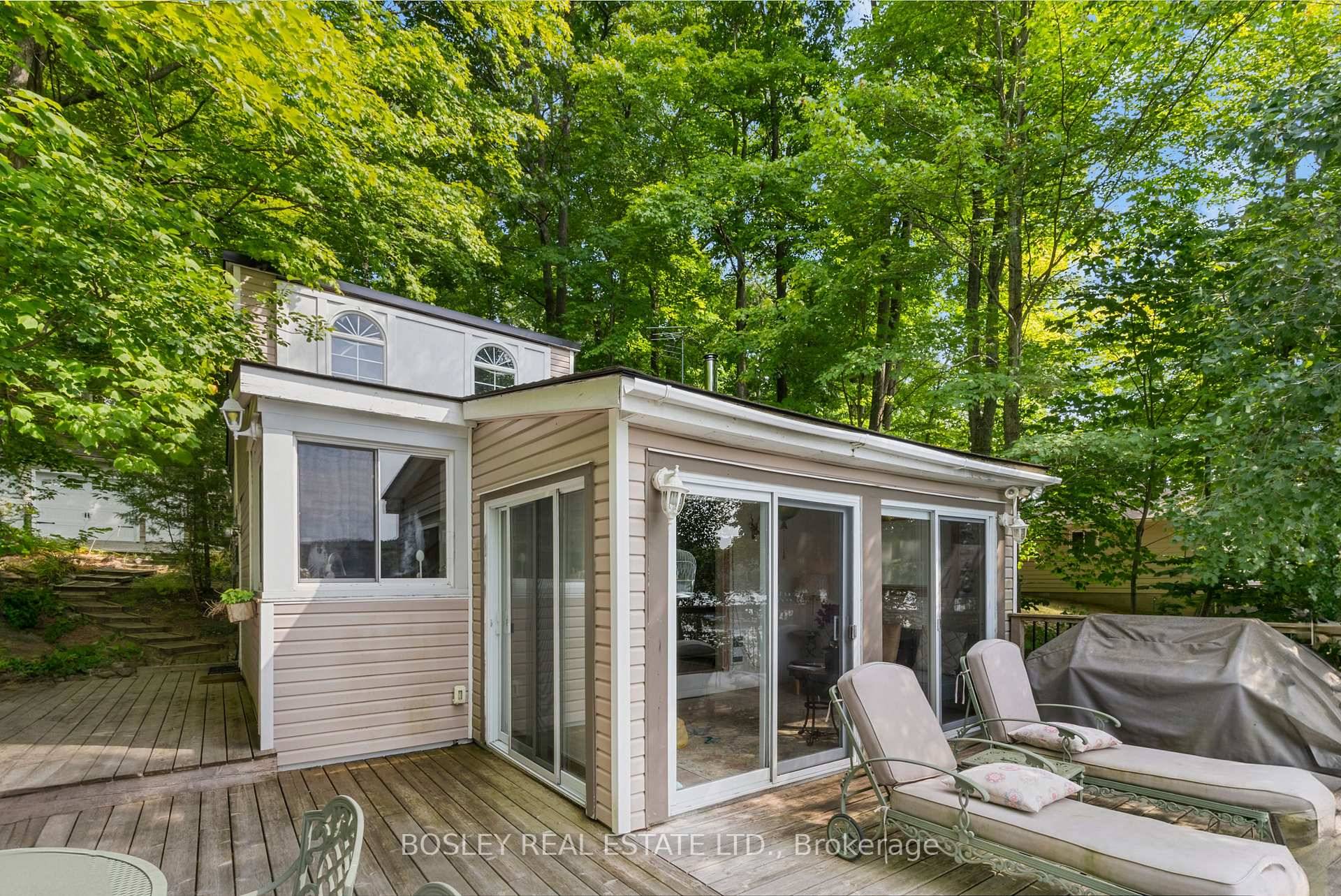 Move right in to this renovated 3 bedroom cottage with the coveted west facing view over the lake.