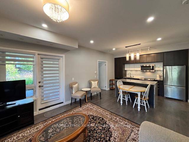 Stunning and Modern Ground Floor, Corner Two Bedroom, Two Full Bath Condo Apartment Featuring 9ft Ceilings, Laminate Floors, Pot Lights, and A Bright Open Concept Layout with A Gourmet Kitchen ...