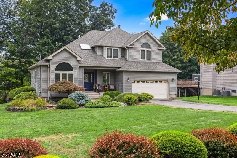 Step into this beautifully designed Colonial home where high vaulted ceilings throughout the main floor create a bright, open and inviting atmosphere.
