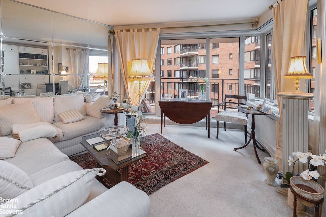 Sunny and spacious one bedroom home in Sutton Place's best post war building.