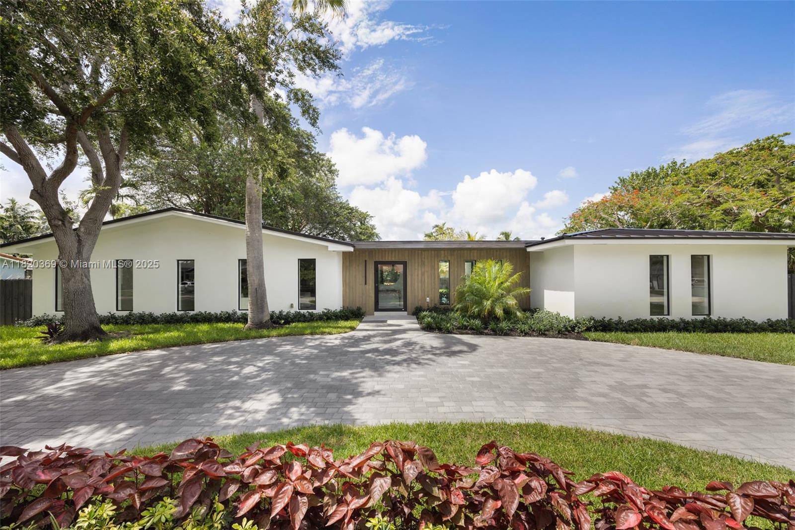 This custom corner lot residence is a masterclass in luxury craftsmanship, reimagined with the finest materials and an uncompromising attention to detail.