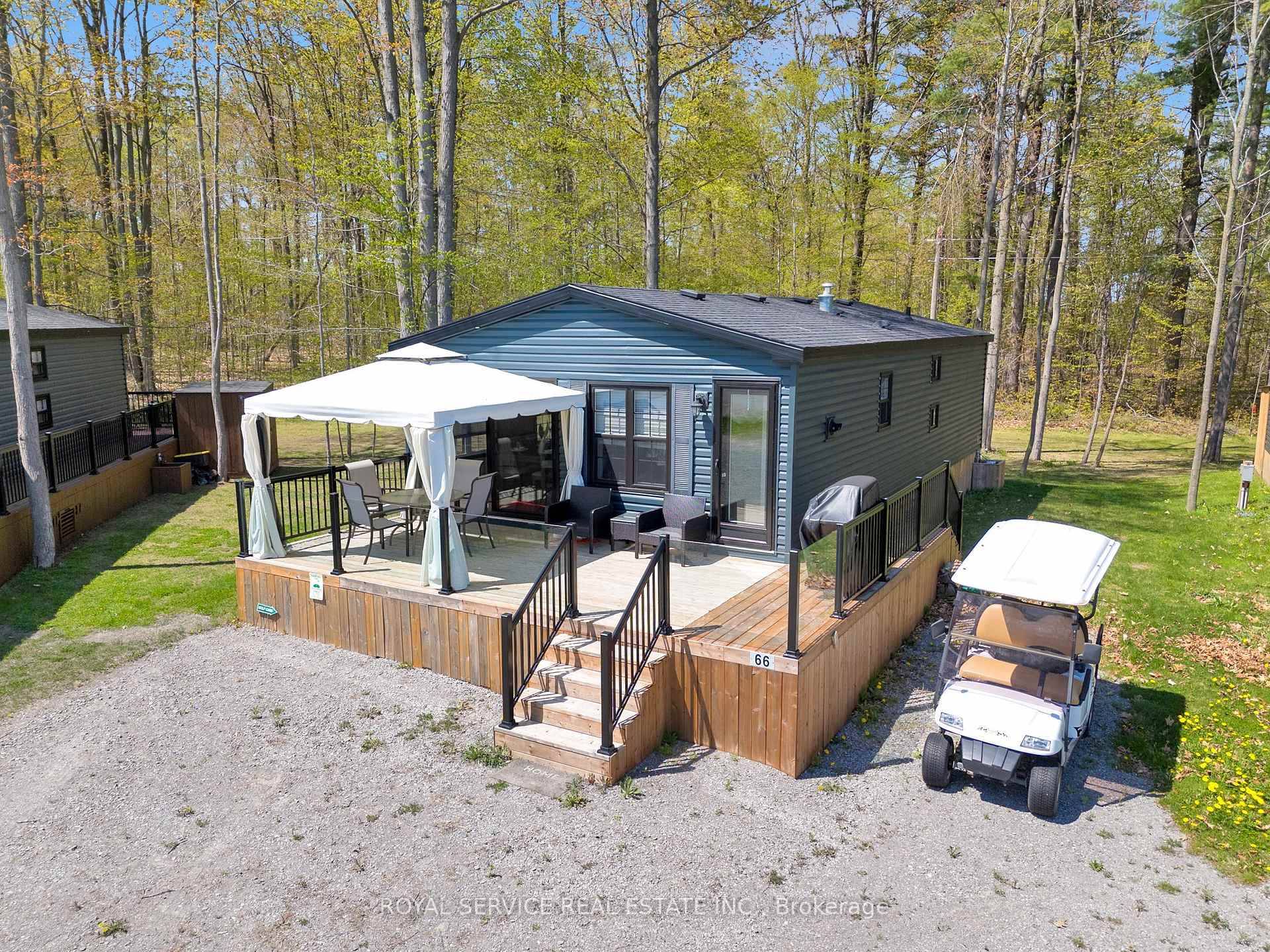 Imagine summer mornings with coffee on the deck, afternoons on the golf course, and evenings around the firepit welcome to 66 Cherry Hill Lane at Bellmere Winds Golf Resort.