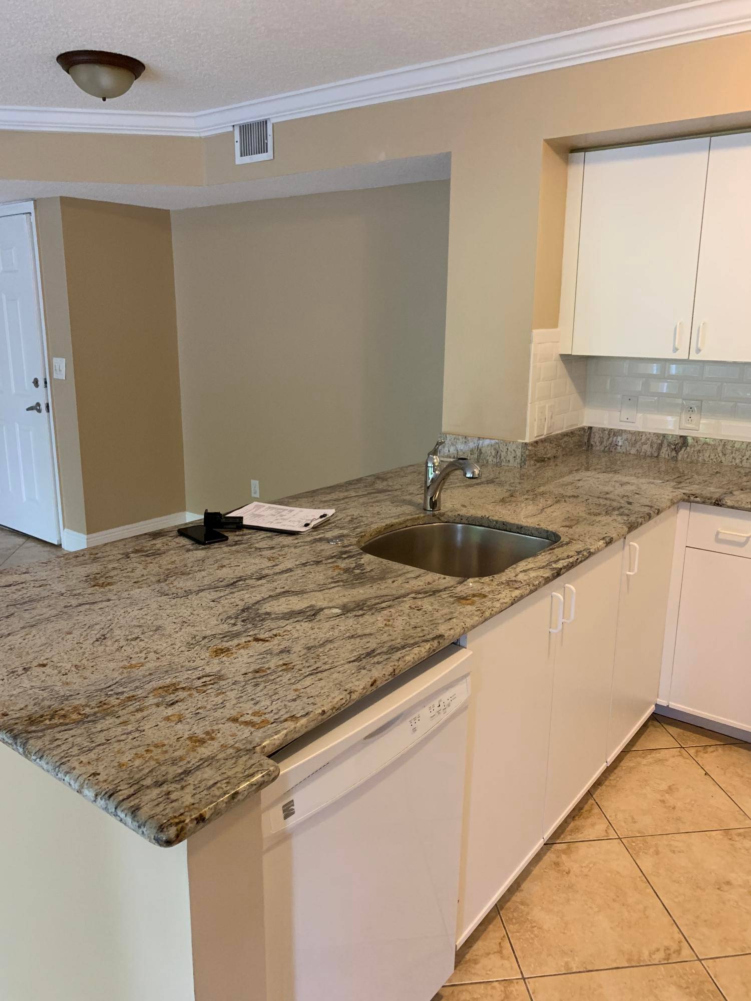 Recently renovated 3 bedroom condo with open kitchen, granite, SS appliances and tile and wood floors.