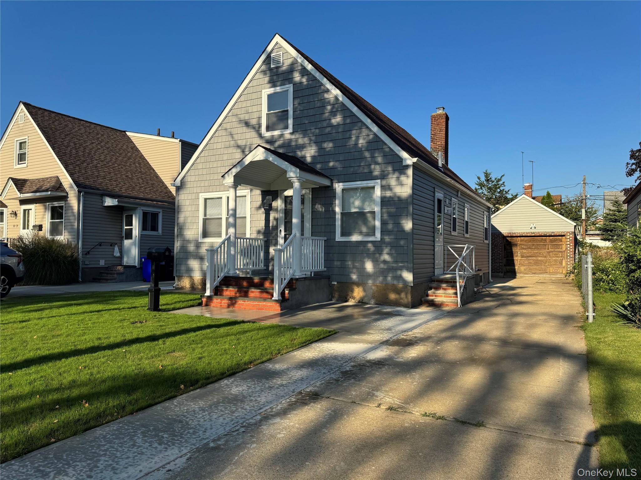 This beautifully renovated Cape style home features three spacious bedrooms and gleaming hardwood floors throughout.