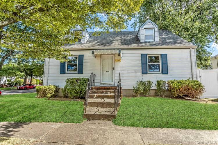 Welcome to this well maintained Cape on a tree lined street in New Hyde Park !