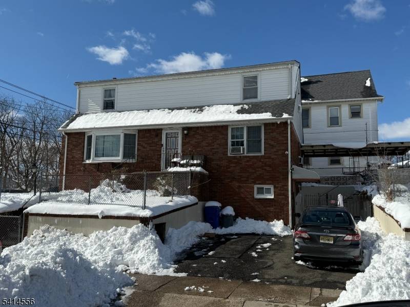 Well maintained two family property offering two residential units plus a full finished walk out basement providing additional living or recreational space.