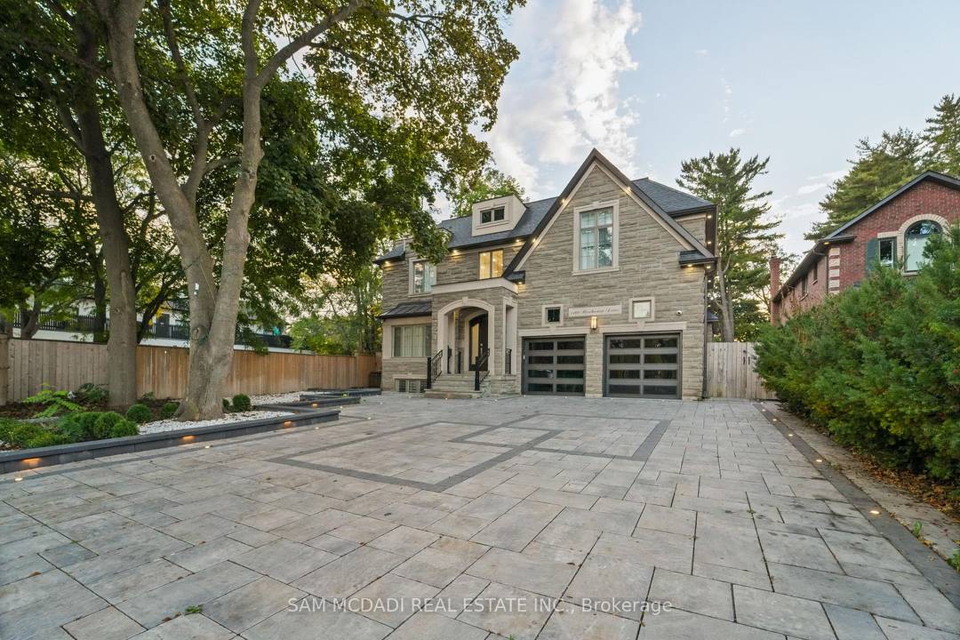 This distinguished residence sits quietly on one of Lorne Park's most desirable streets, surrounded by mature trees and a true sense of privacy.