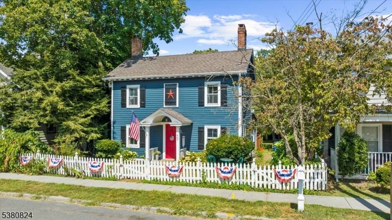 Step through the covered porch and feel the warmth of home wash over you.