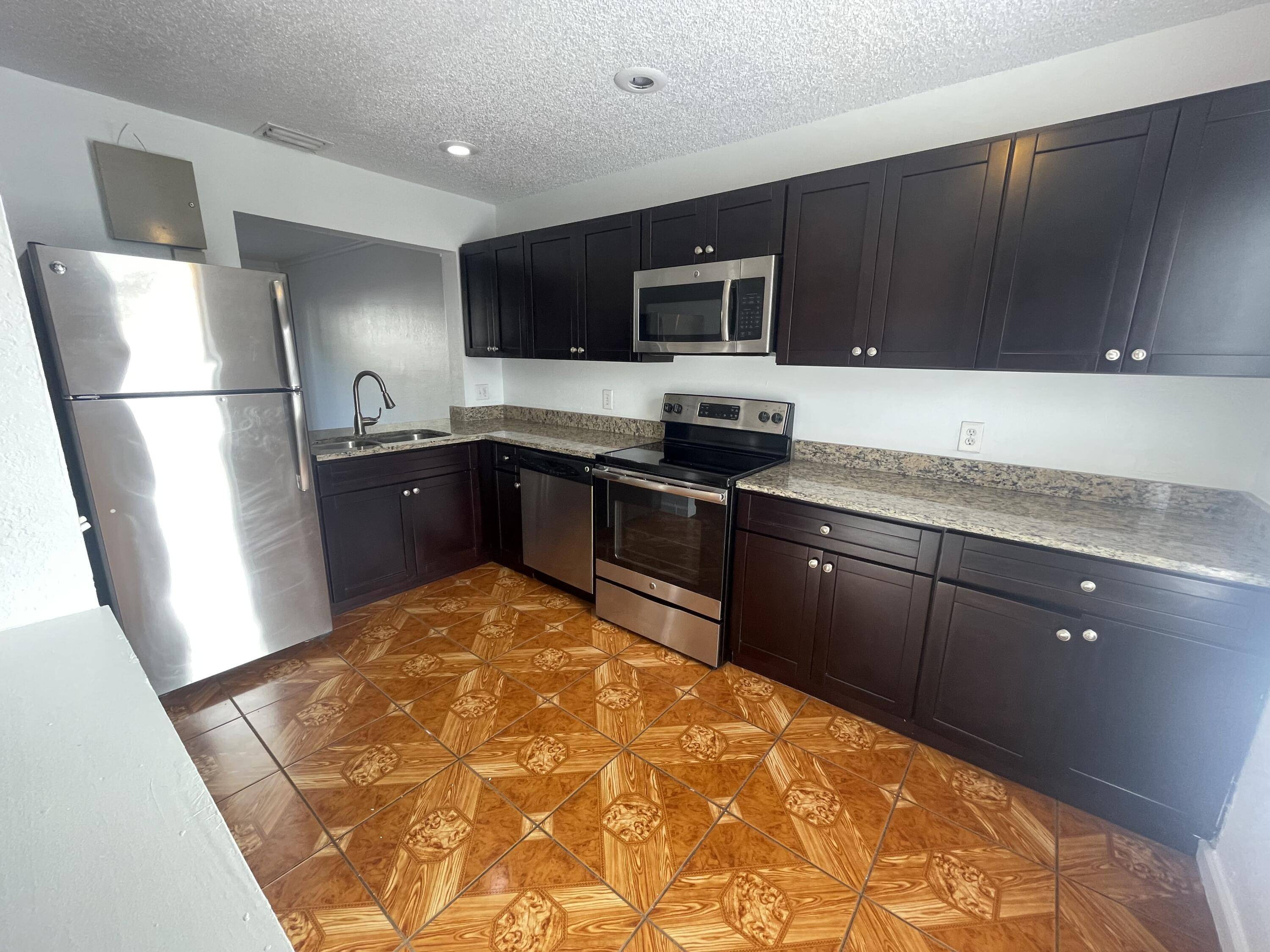 This two story townhouse, located in a well established all ages community in West Palm Beach, is currently part of a portfolio of four investment properties.