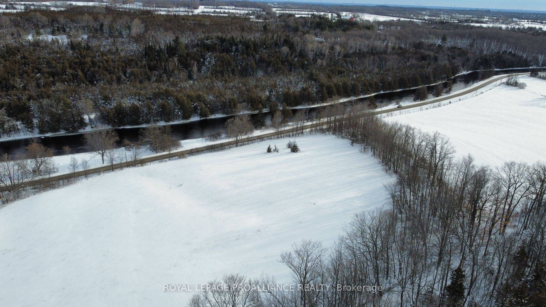 The East lot overlooking The Salmon River 30 min North from popular Prince Edward County only 6 Km from 401.