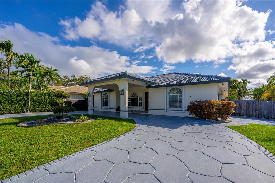 The most desirable 1 story property in the area with porte cochere, circular driveway and a converted 2 car garage.