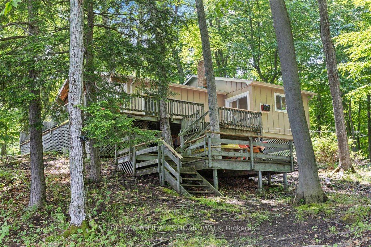 This exceptional waterfront retreat offers nearly 5 acres of private, serene land with over 600 feet of pristine, deep water frontage on one of the most sought after lakes in ...