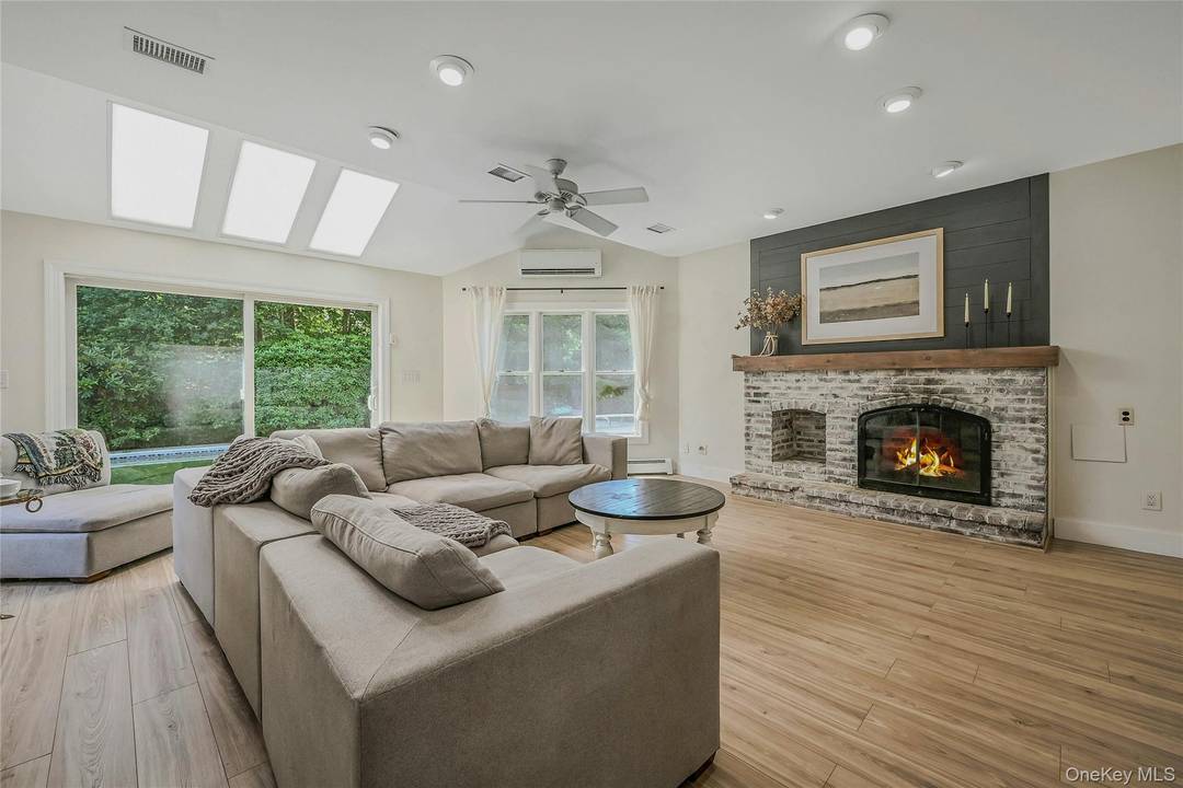 This 5 bedroom Colonial, totaling 3700sqft, is situated on a rare.