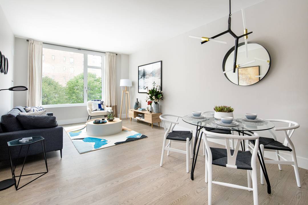 Residence 517 features oversized windows, a dressing area, and an in unit Bosch washer dryer.