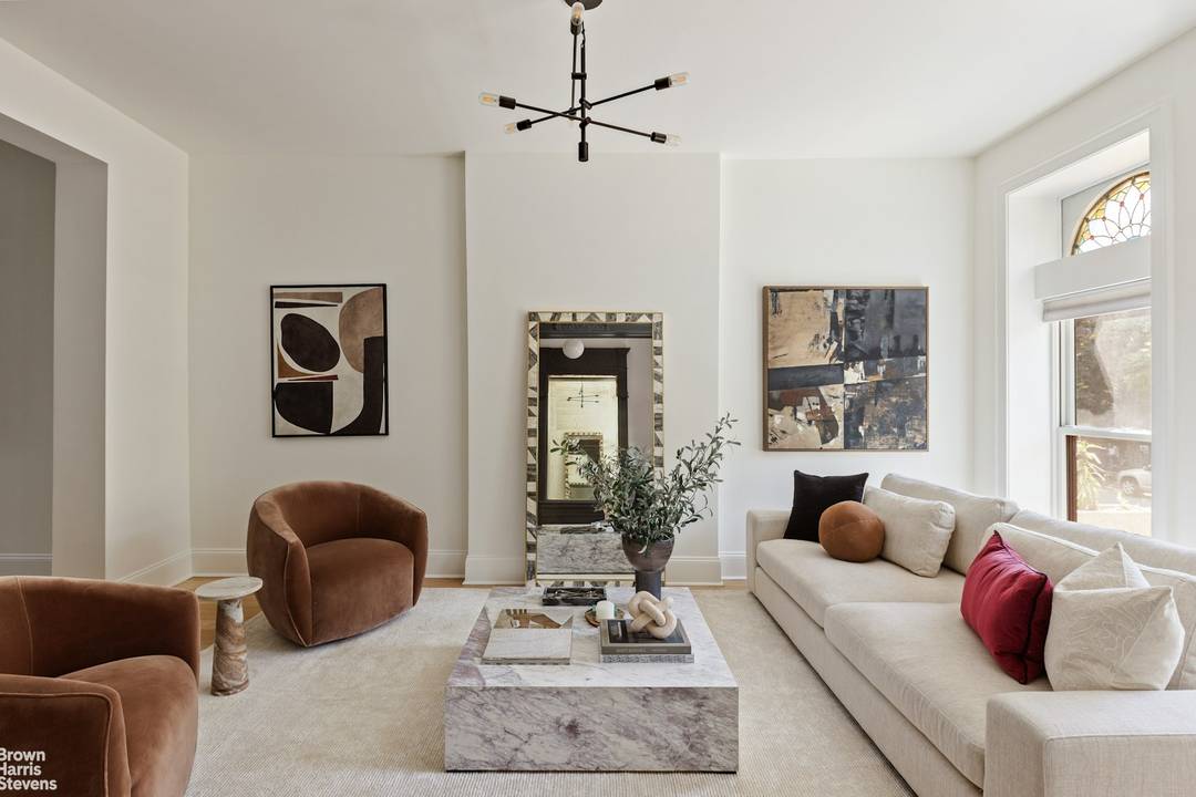 Soak up the sun and skyline views from your private rooftop deck, accessed via a fully retractable skydoor just one of the many standout features of this meticulously updated brownstone ...