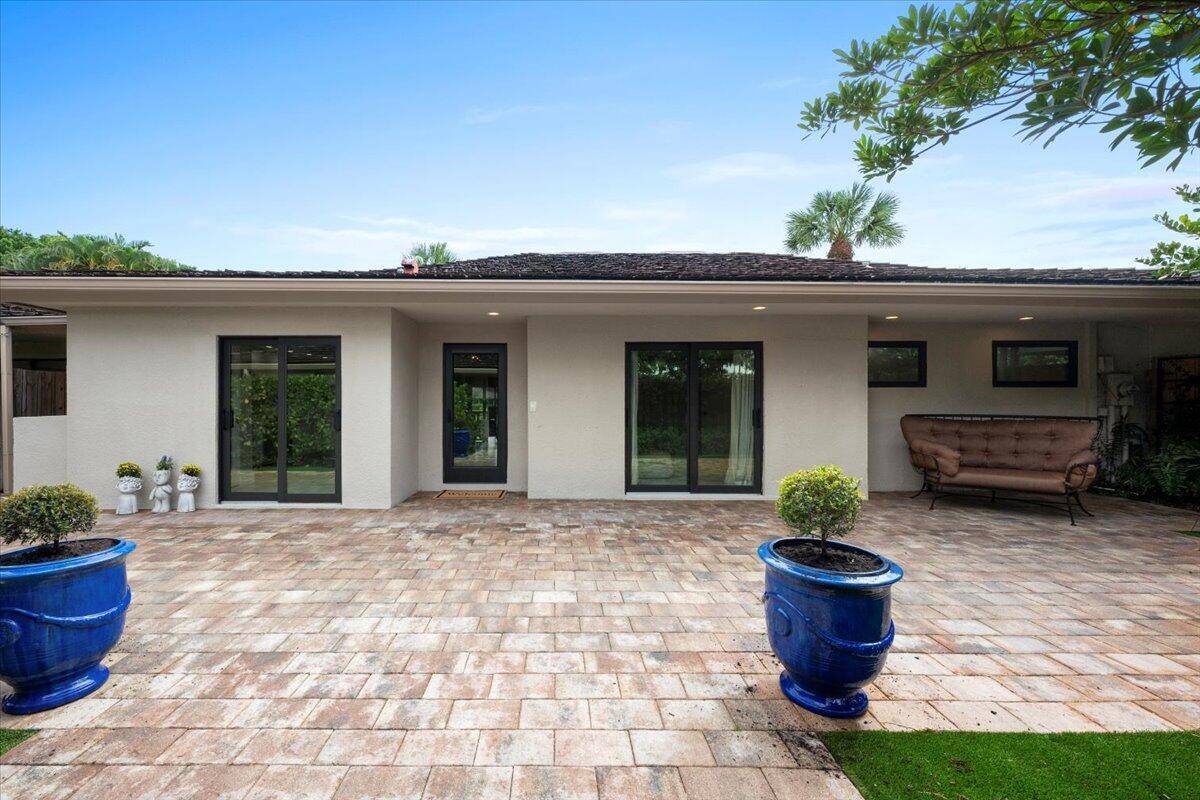 Welcome home to 11683 Wimbledon Circle, located in the desirable East Lake Bungalows of Palm Beach Polo Club.