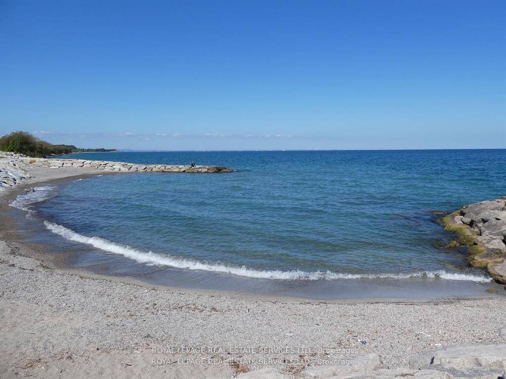 Award Winning, PREMIUM CORNER UNIT with 2 bedrooms and 2 baths plus 2 balconies with FABULOUS VIEWS of LAKE Ontario and the Niagara Escarpment !