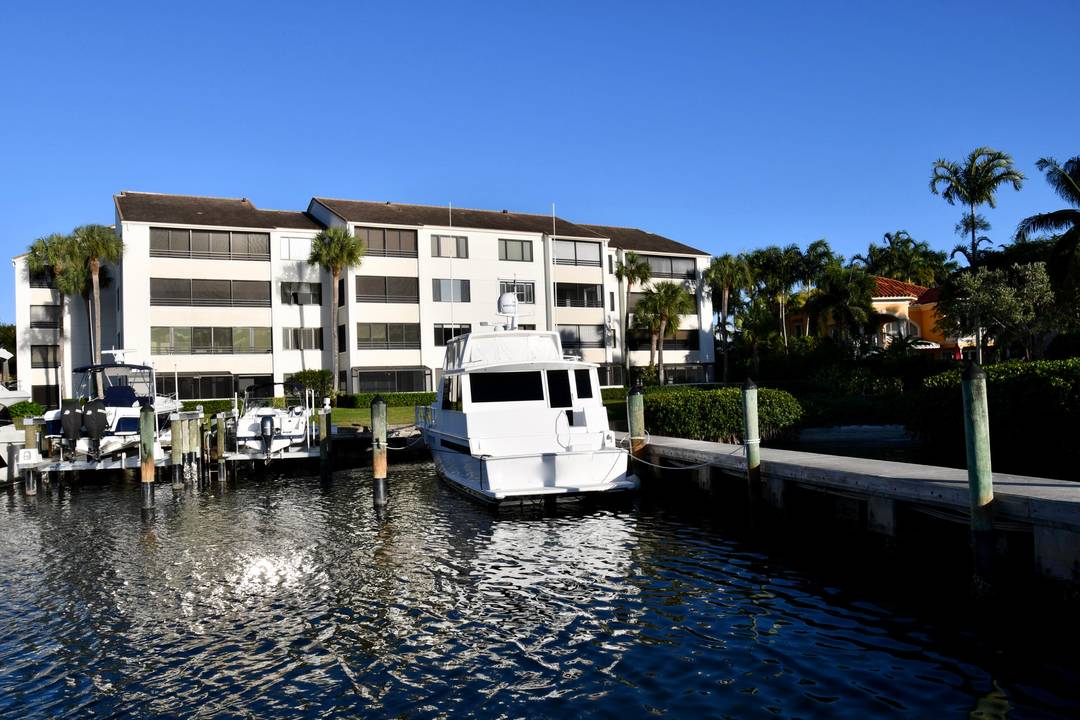 Wake up to shimmering Intracoastal views from the primary suite or unwind as yachts drift by from your expansive screened balcony.