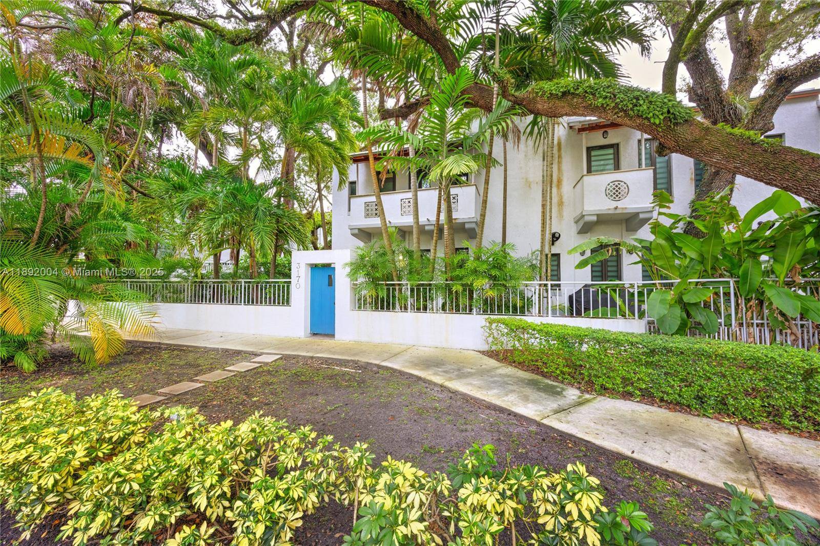 In the heart of Coconut Grove, this impeccable 3 bed 2.