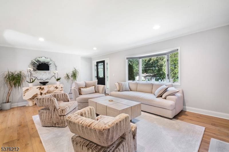 Tucked away at the end of a quiet, tree lined cul de sac, this luxury sprawling ranch offers both privacy and an exceptional living space.