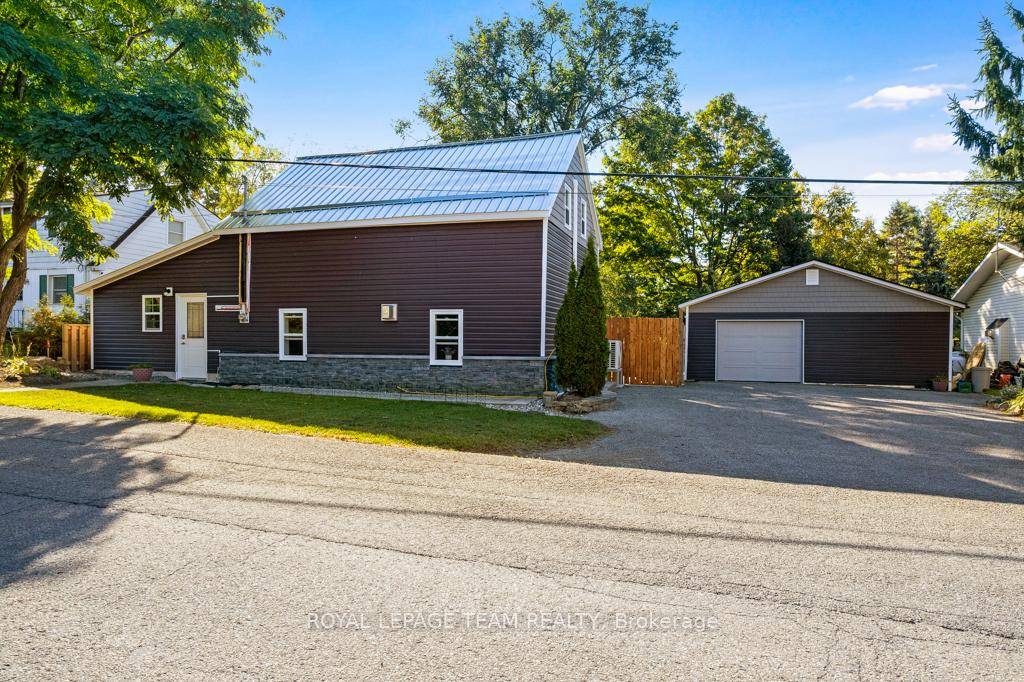 Step into timeless charm and modern comfort with this beautifully restored 1830s log home, located in the historic village of Merrickville.