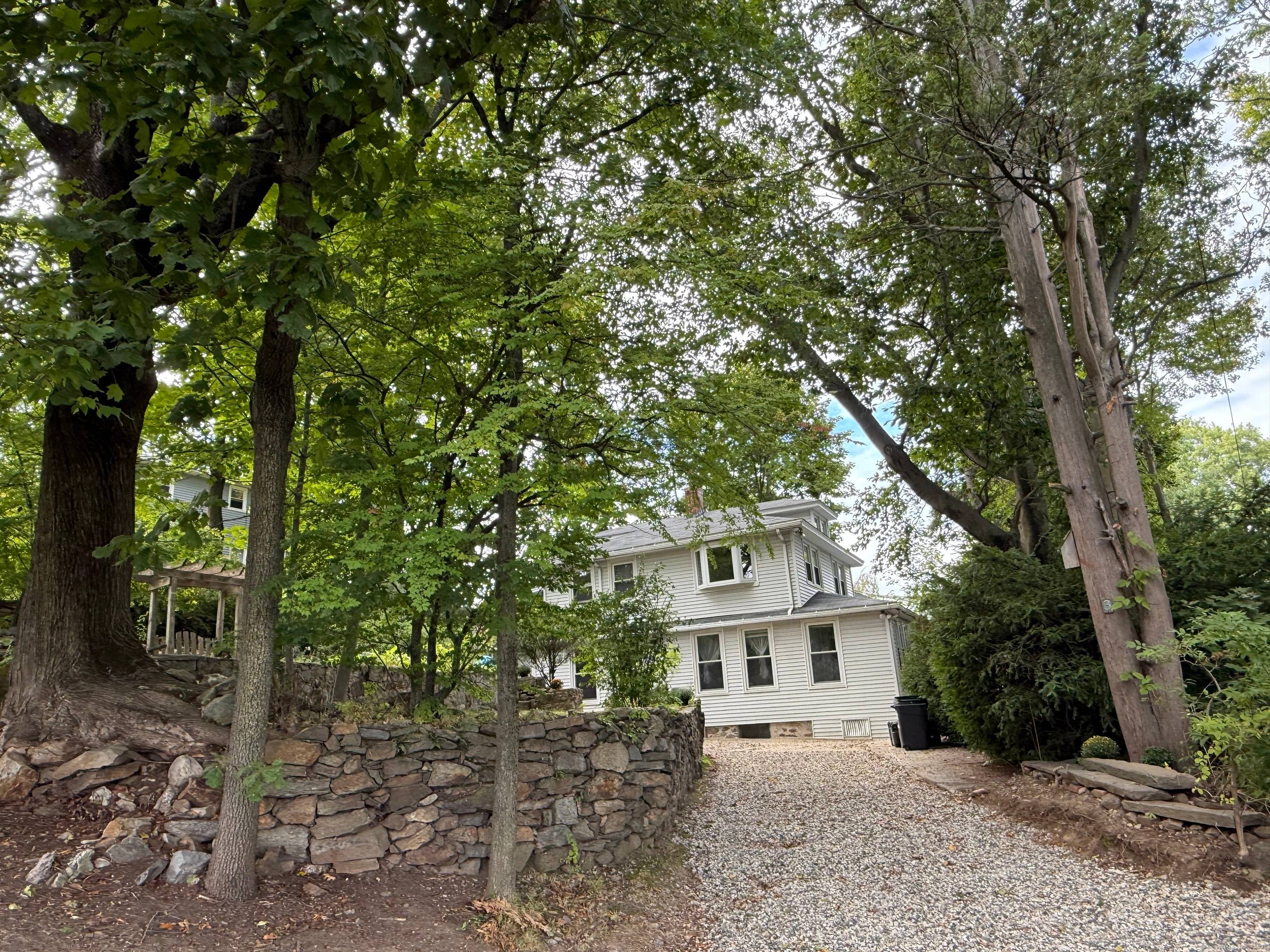 This two family nestled in an extra large wooded lot conveniently near downtown Norwalk is great opportunity for a creative contractor !
