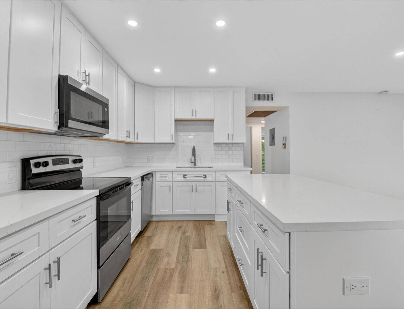Open floor plan with large kitchen island light and bright unit 2 bedrooms with 1 and a half bathrooms all beautifully updated.