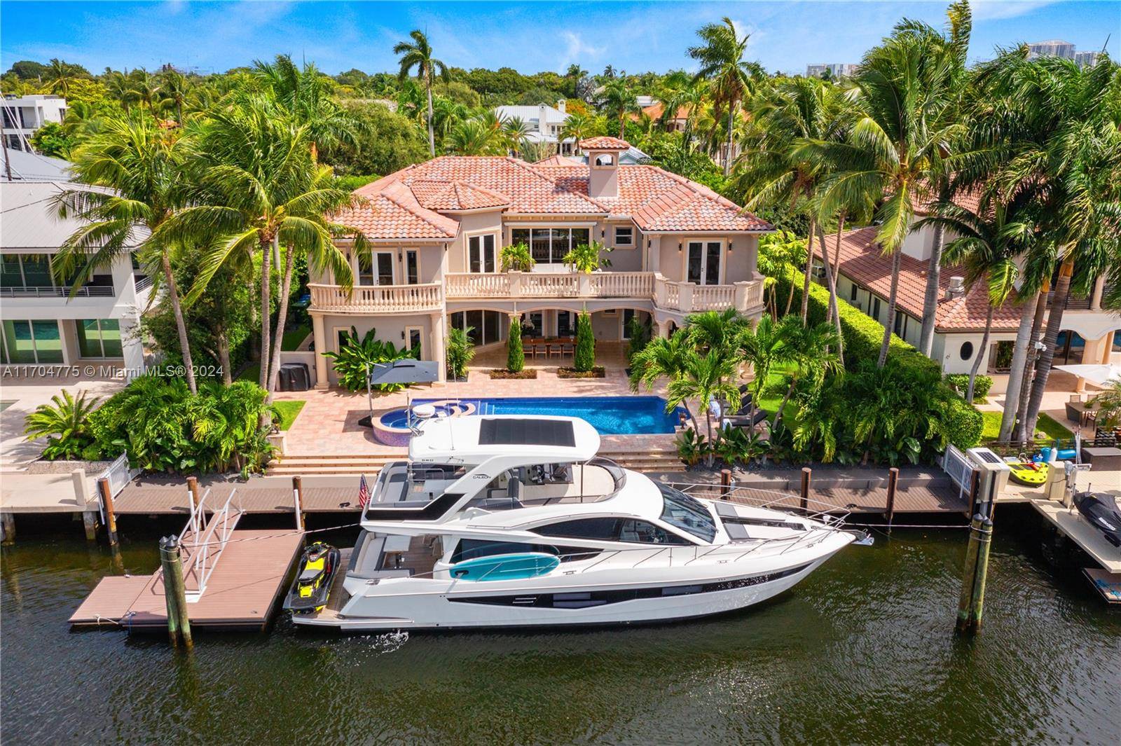 Luxurious Tropical Mediterranean estate in Coral Ridge with 100 ft of south facing waterfront and recently updated sea wall.