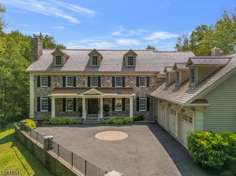 Nestled on 12 acres, this 6 bed, 6.