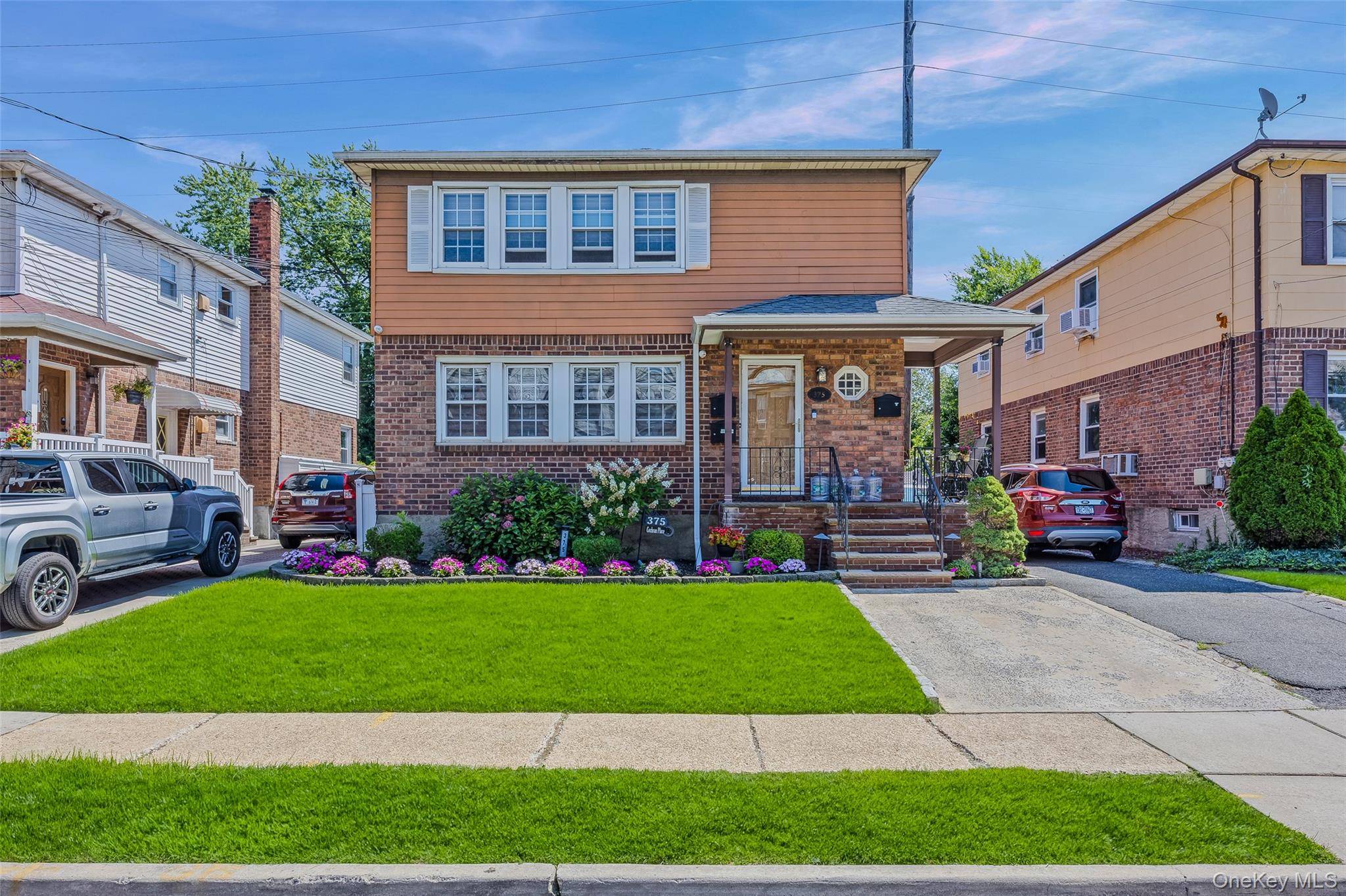 Lovely 2 Family Home, Hewlett Woodmere School District, 6 bedrooms, New Bathroom, Newly renovated Kitchen with island, extra cabinets, drawers and shelves.