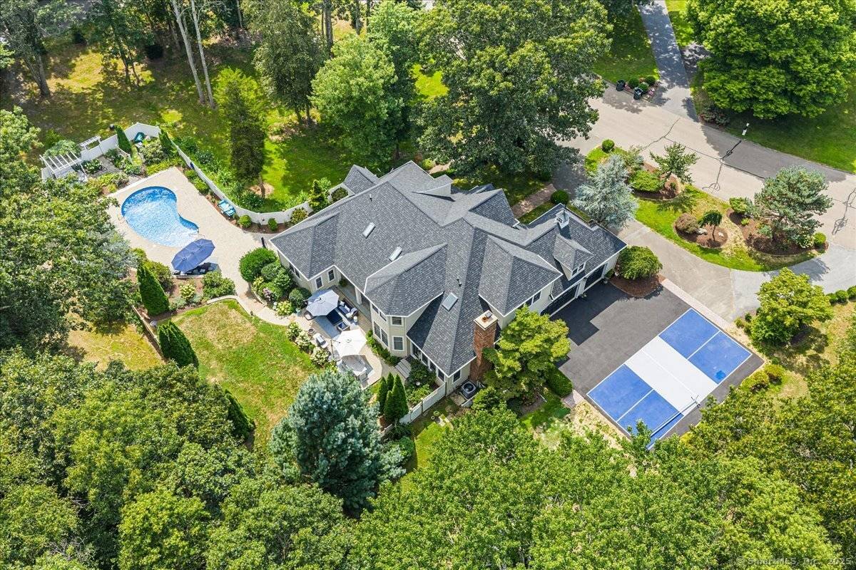 Welcome to 4 Laconia Drive, where timeless elegance meets modern sophistication.