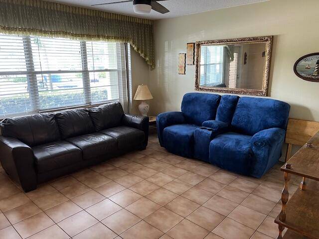 Tile flooring throughout, white kitchen cabinets, walk in shower, furnished.