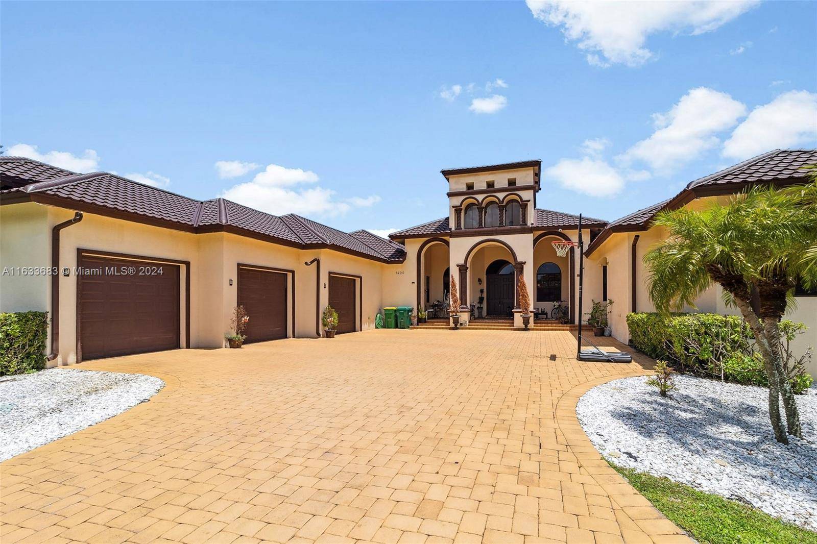 Magnificent custom home with an abundant amount of natural light located in the exclusive Plantation Acres.