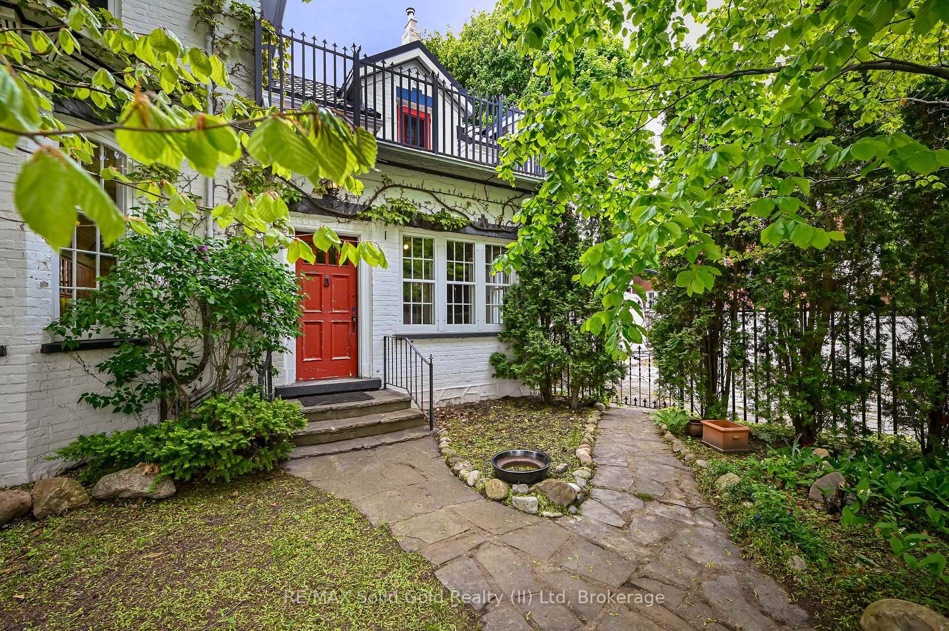 Imagine Lush perennial gardens and a white picket fence surrounding your dream property, echoing the timeless charm of the Italianate style exterior complete with a large covered veranda, stately pillars, ...