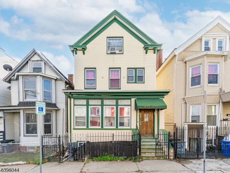 TWO FAMILY WITH BONUS ATTIC AND WALK OUT BASEMENT !