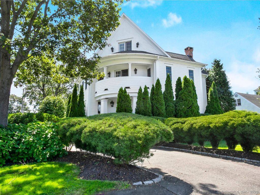 From the moment you arrive, you are captivated w blooming gardens privacy trees that create an inviting curb appeal that welcomes you in.