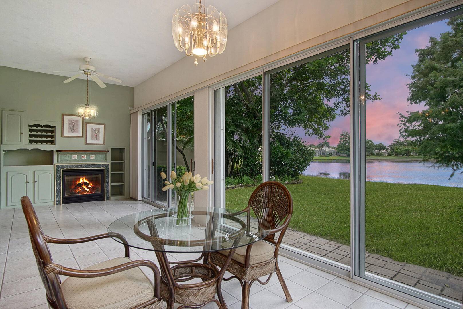 Relax looking out of this wide lake view in this freshly painted 3 2 with an enclosed Florida room.