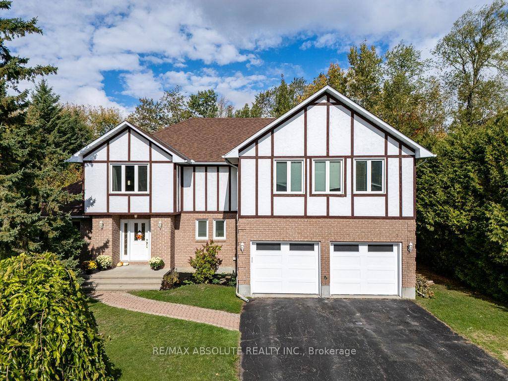 Welcome to this beautifully maintained Tudor style home set on a private, tree lined lot in a peaceful and family oriented community.